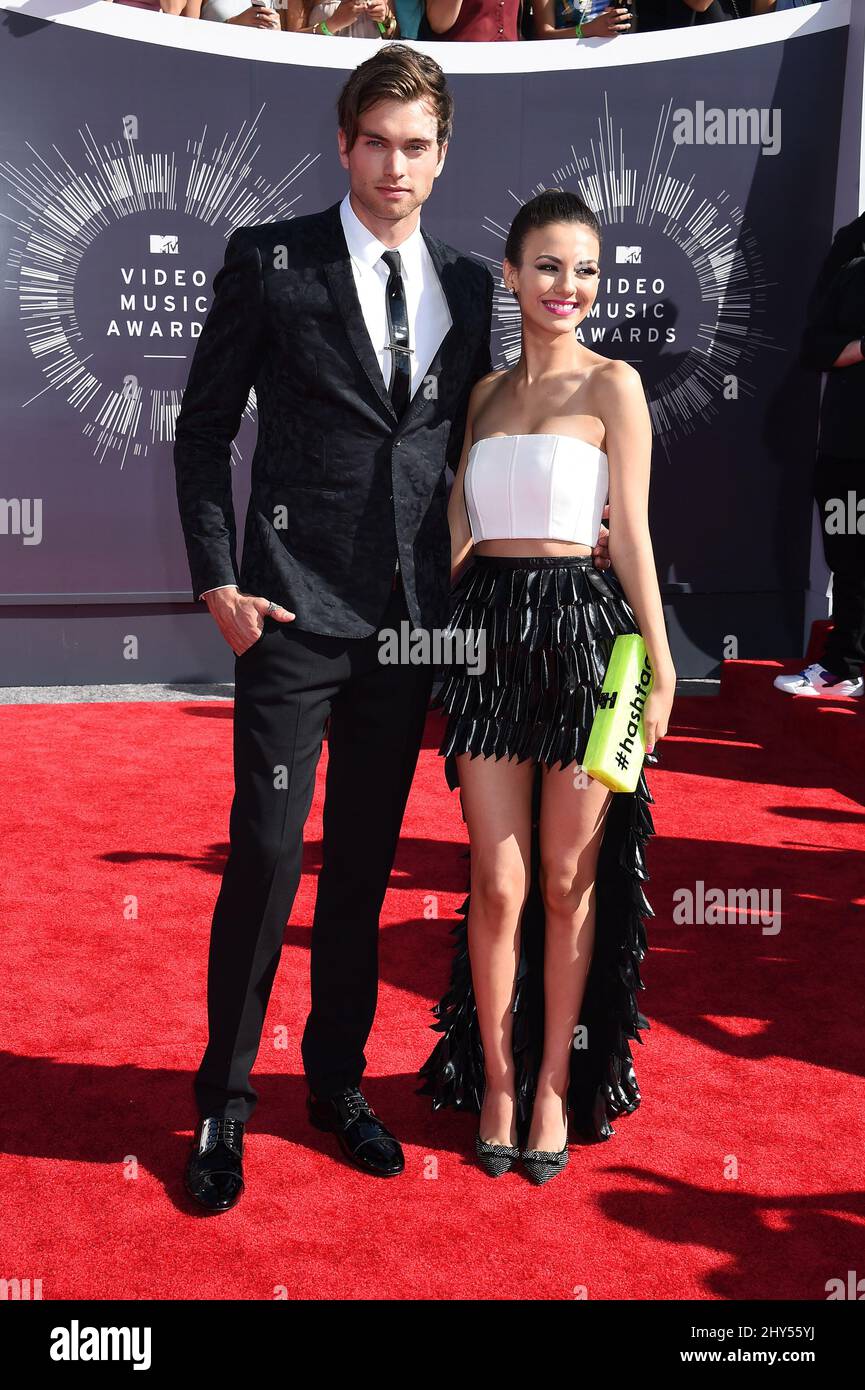 Pierson Fode and Victoria Justice arriving at the 2014 MTV Video Music  Awards held at The Forum Stock Photo - Alamy