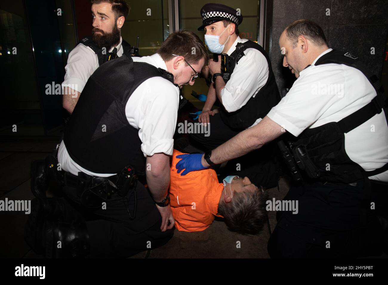 London, England, UK 14 March 2022 One man protest at the Department of Transport against HS2 and the use of Russian oligarch money in its construction. During the protest a supporter, Dr Larch Maxey, who came along to observe, is violently arrested. Credit: Denise Laura Baker/Alamy Live News Stock Photo
