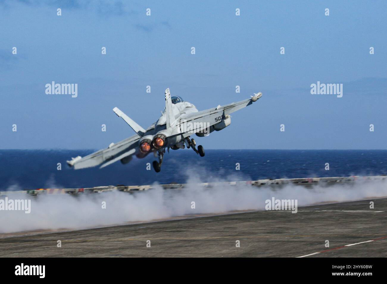 PHILIPPINE SEA (March 13, 2022) An EA-18G Growler, assigned to the "Wizards" of Electronic Attack Squadron (VAQ) 133, launches from the flight deck of the Nimitz-class aircraft carrier USS Abraham Lincoln (CVN 72). Abraham Lincoln Strike Group is on a scheduled deployment in the U.S. 7th Fleet area of operations to enhance interoperability through alliances and partnerships while serving as a ready-response force in support of a free and open Indo-Pacific region. (U.S. Navy photo by Mass Communication Specialist Seaman Apprentice Julia Brockman) Stock Photo