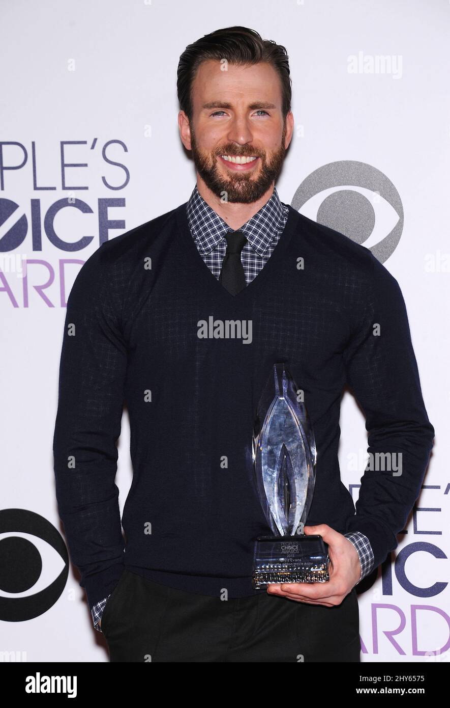 Chris Evans poses in the press room with the award for favorite action movie actor at the People's Choice Awards at the Nokia Theatre on Wednesday, Jan. 7, 2015, in Los Angeles. Stock Photo