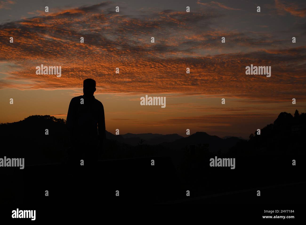 Silhouette of a man jumping at sunset hi-res stock photography and ...