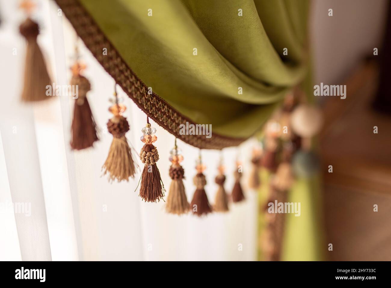 Selective focus shot of fringes of curtains Stock Photo