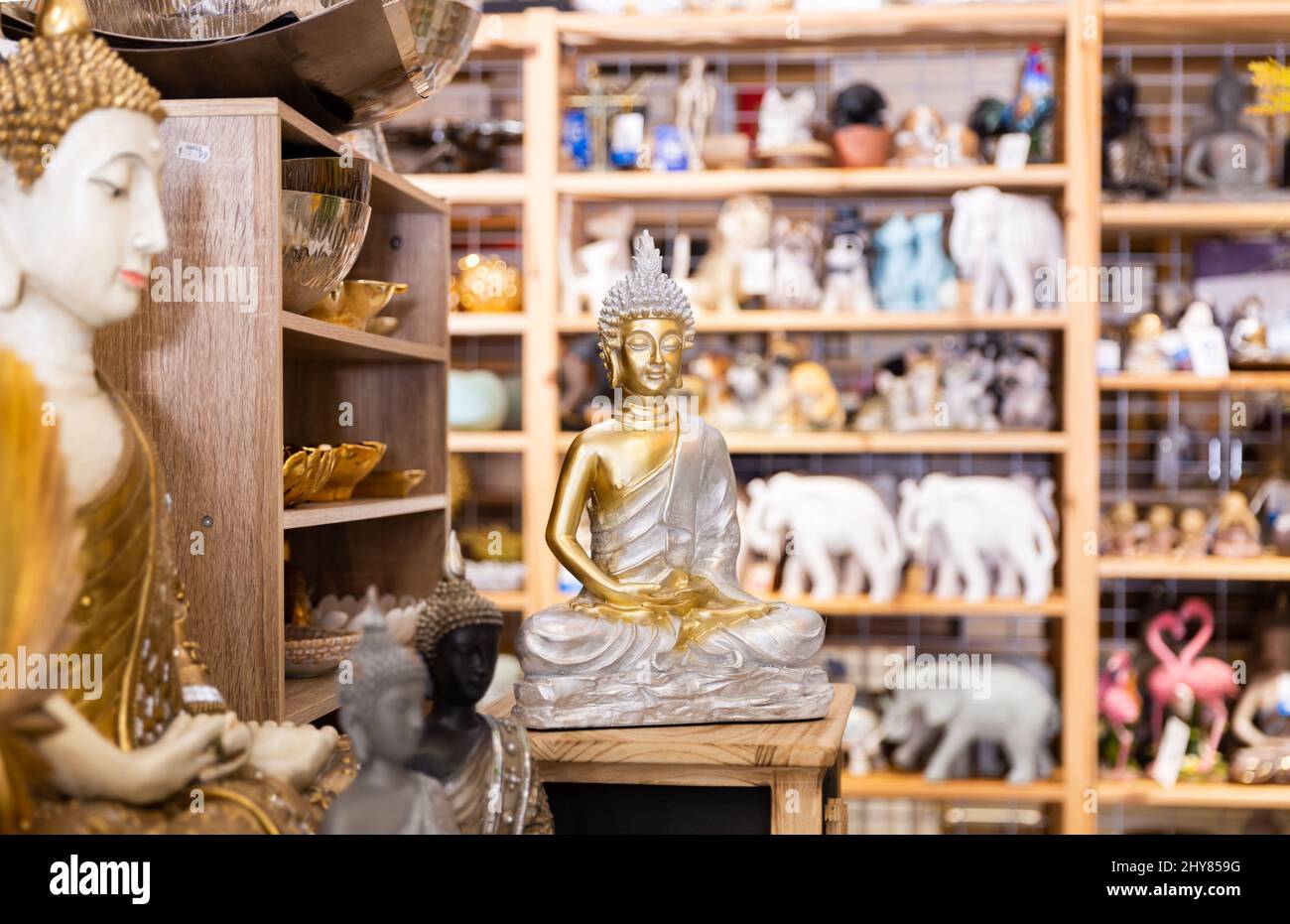 Buddha decorative statues at household goods store Stock Photo Alamy