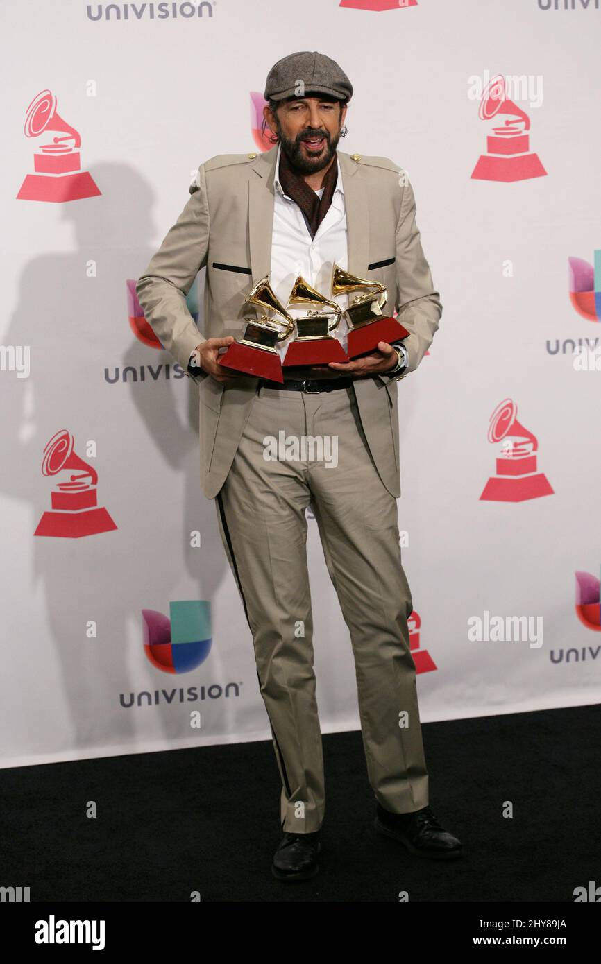 Juan Luis Guerra poses in the press room at the 16th annual Latin Grammy Awards at the MGM Grand Garden Arena on Thursday, Nov. 19, 2015, in Las Vegas.. Stock Photo