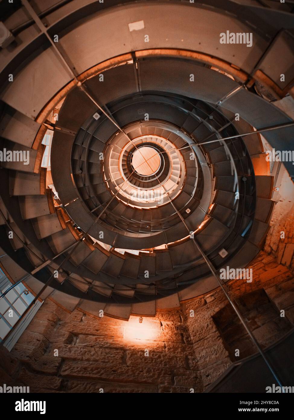 Vertical shot of lighthouse spiral staircase located in Glasgow, Scotland Stock Photo