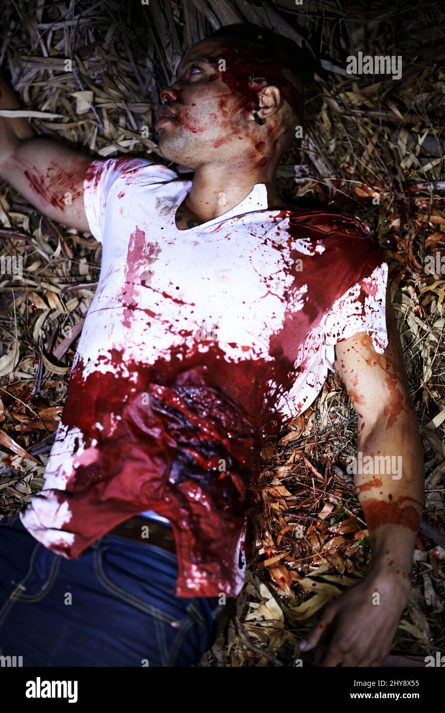 Another senseless crime. A cropped shot of a murder victim found outdoors. Stock Photo