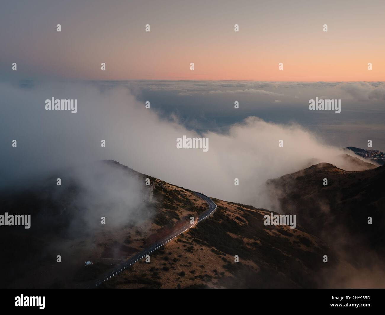 Aerial view of floating misty clouds over brown hills Stock Photo - Alamy