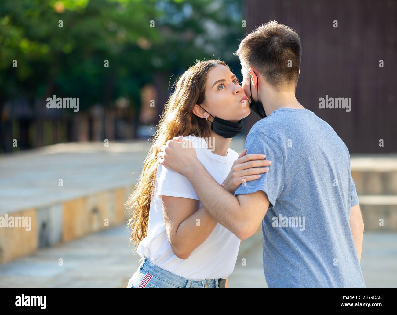 Girl is kissing a guy Stock Photo - Alamy