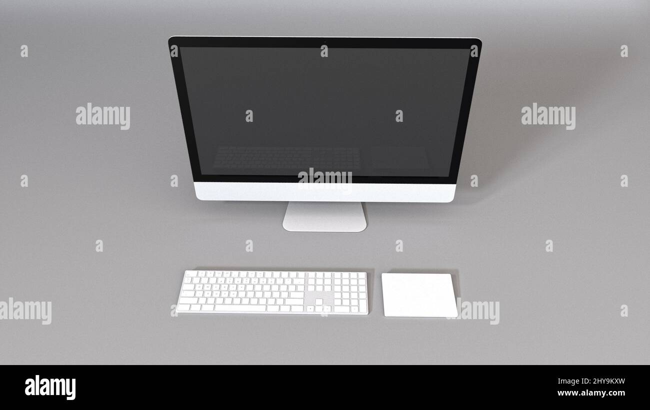 Top view of a monitor and a keyboard on a gray background Stock Photo