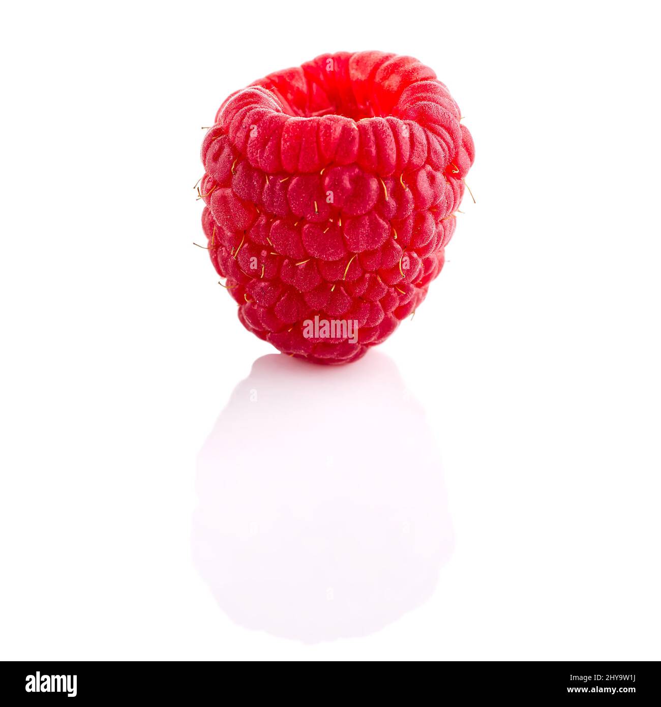 One ripe raspberry isolated on white backdrop Stock Photo