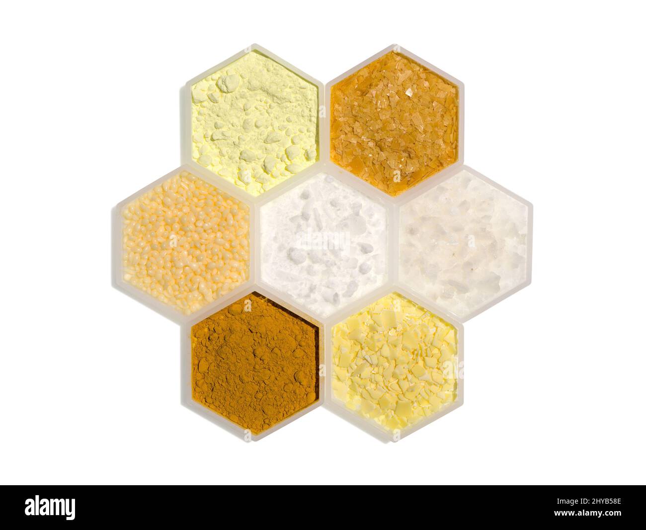 Chemical ingredient in hexagonal molecular shaped container. Sulfur Powder, Carnauba Wax, Candelilla Wax, Cetyl Esters Wax, Flake Salt, Curcuma Powder Stock Photo