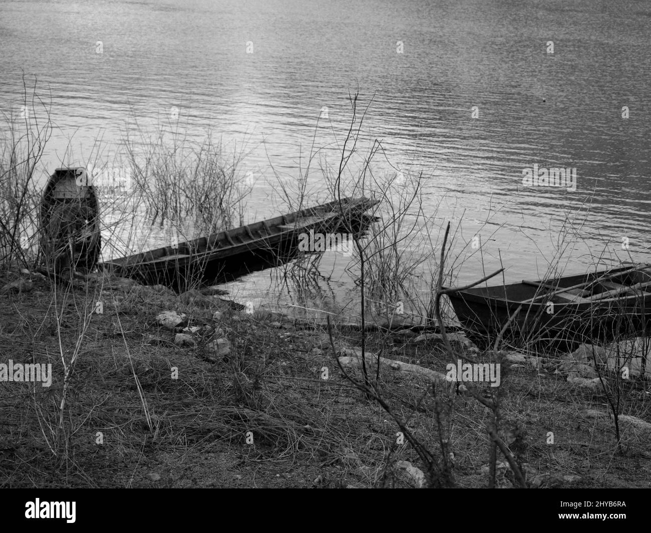 Two old wooden boats moored on the banks of the river. vintage tone Stock Photo