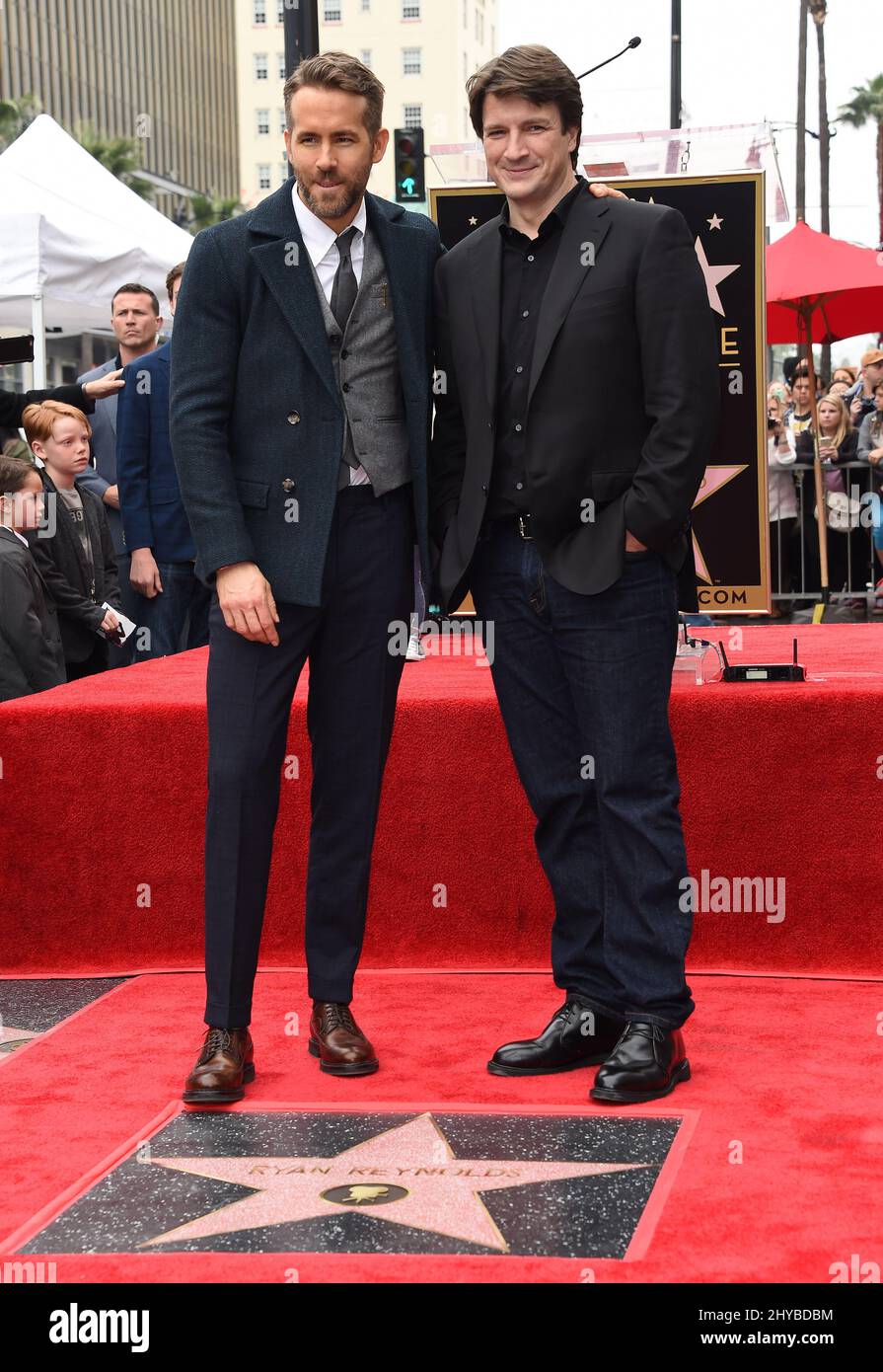 Ryan Reynolds and Nathan Fillion during Ryan Reynolds Hollywood Star Ceremony held at Hollywood