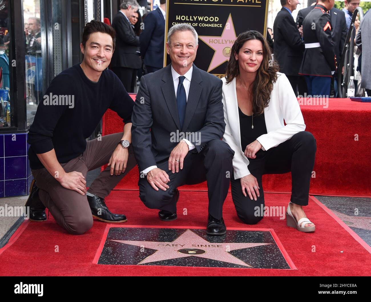 Daniel Henney, Gary Sinise and Alana de la Garza attending Gary Sinise's Hollywood star unveiling ceremony in Los Angeles Stock Photo