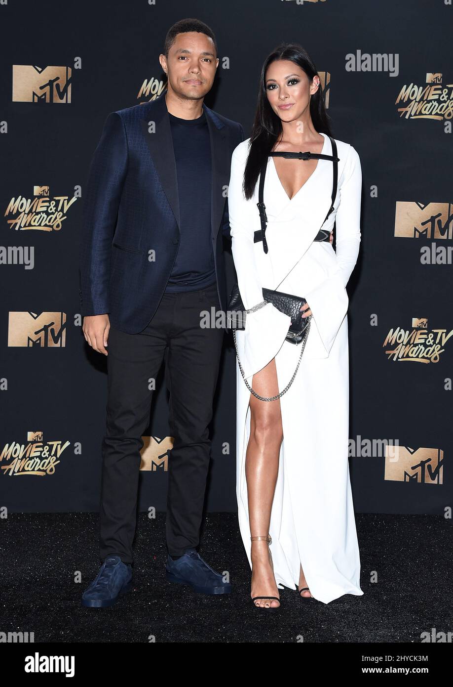 Trevor Noah and Jordyn Taylor arriving for the 2017 MTV Movie and TV Awards held at the Shrine Auditorium in Los Angeles, USA Stock Photo