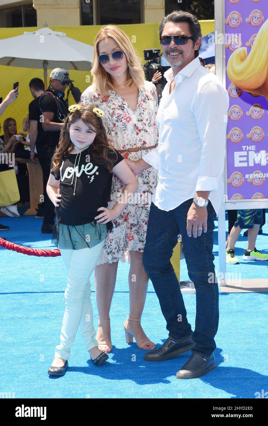 Lou Diamond Phillips, Yvonne Boismier Phillips and Indigo Phillips attending The Emoji Movie World Premiere held at the Regency Village Theatre Stock Photo
