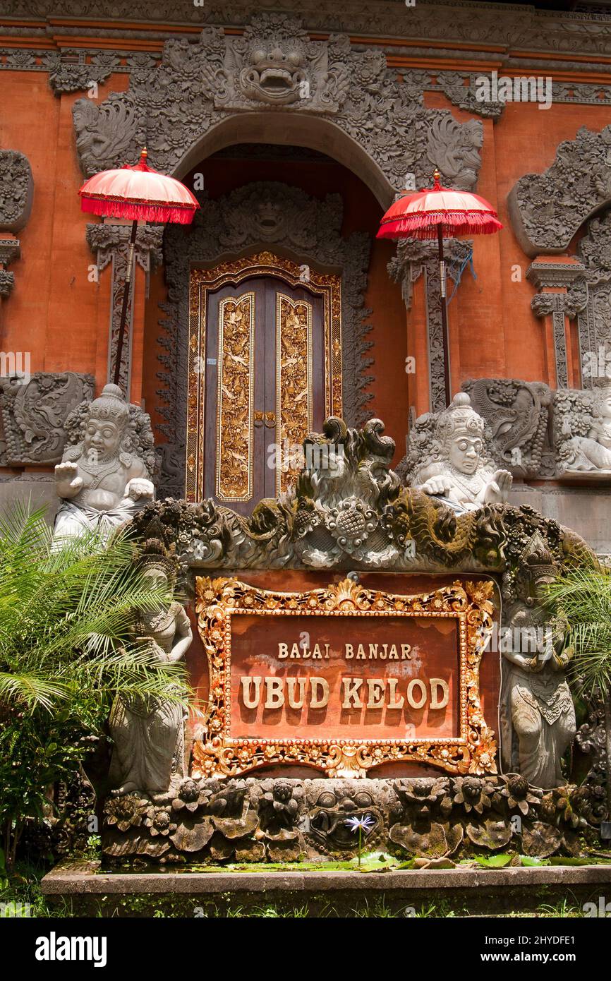 Front view of decorated entrance of the Balai Banjar Ubud Kelod building in Ubud, Bali, Indonesia, on a sunny day. Stock Photo