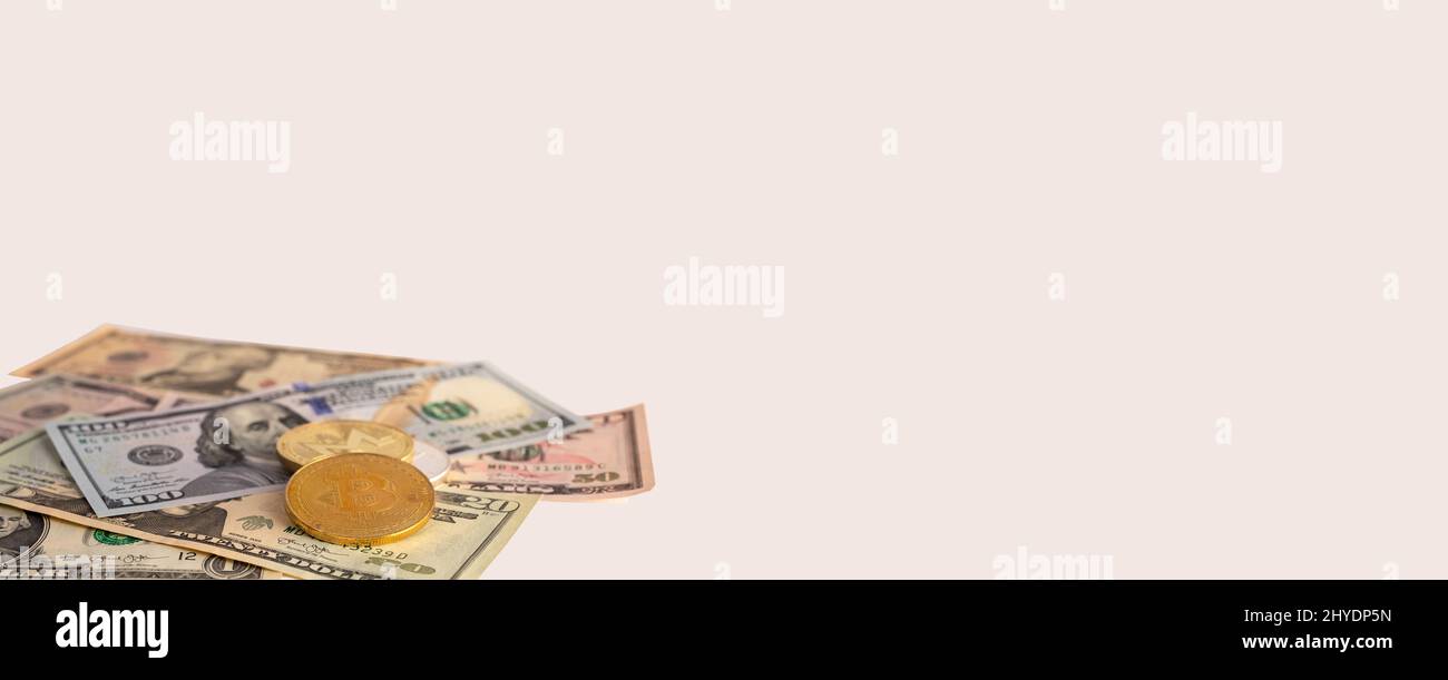 Banner with US dollars bills and coins. Cryptocurrency at American money pile. Income, finance and tax concept. Place for text. High quality photo Stock Photo