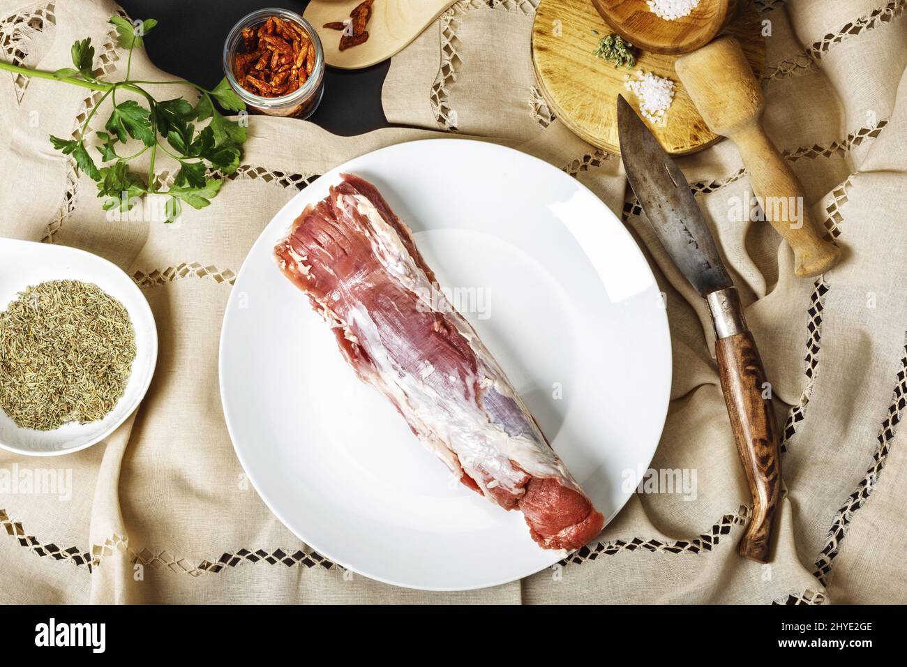 Top view shot of fresh raw pork in a white plate Stock Photo