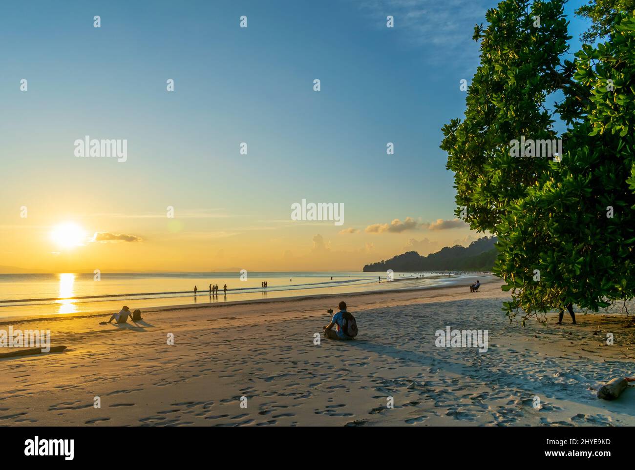A travel photographer on the beach Stock Photo