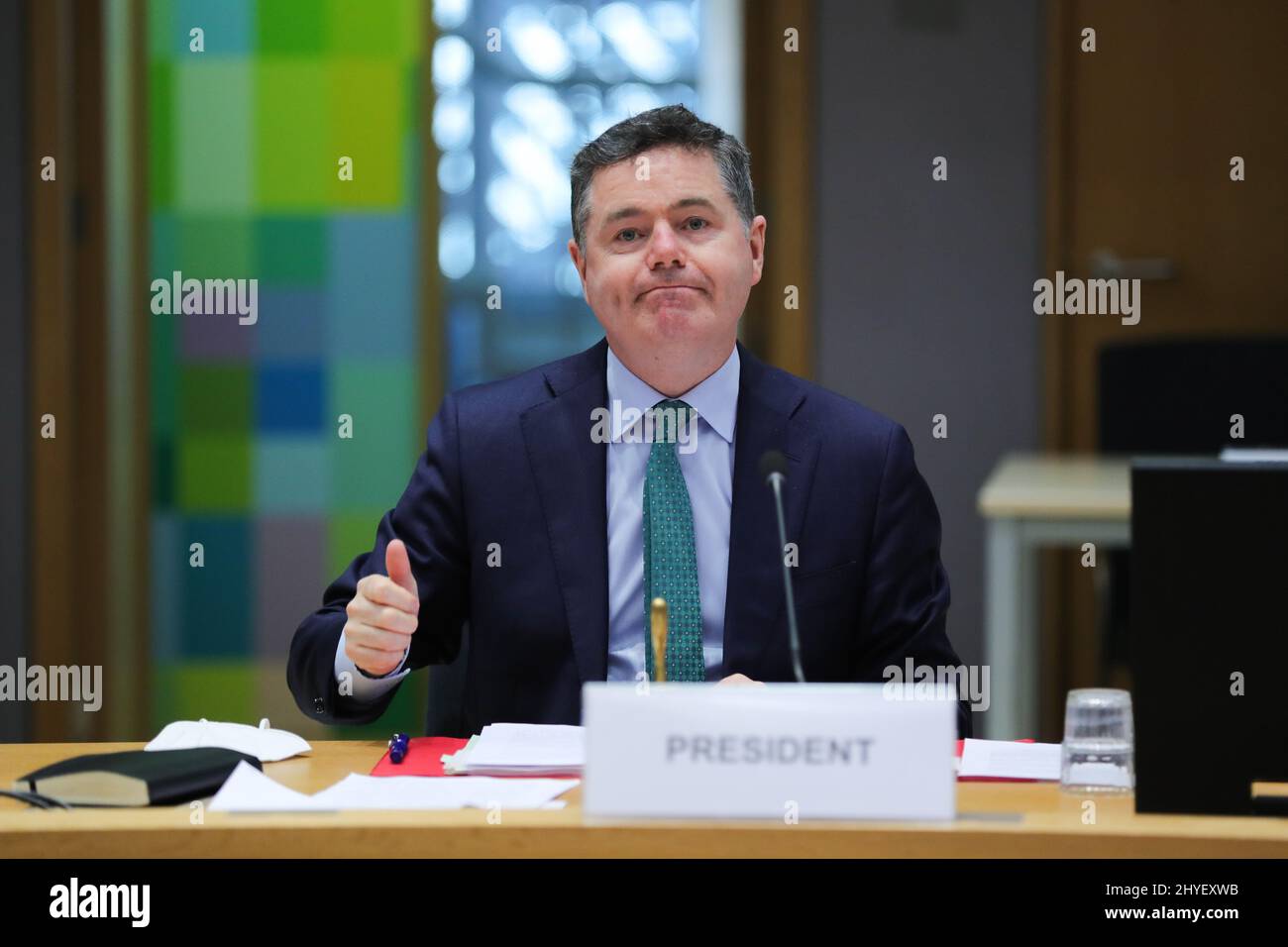 Brussels, Belgium. 14th Mar, 2022. Paschal Donohoe, president of the Eurogroup, chairs a meeting of the Eurogroup in Brussels, Belgium, March 14, 2022. The Euro area will mitigate the impact of the Russia-Ukraine conflict on its economy by closely monitoring the situation and by promptly adjusting its fiscal policy if needed, said officials on Monday evening after a meeting of the Eurogroup. Credit: Zheng Huansong/Xinhua/Alamy Live News Stock Photo