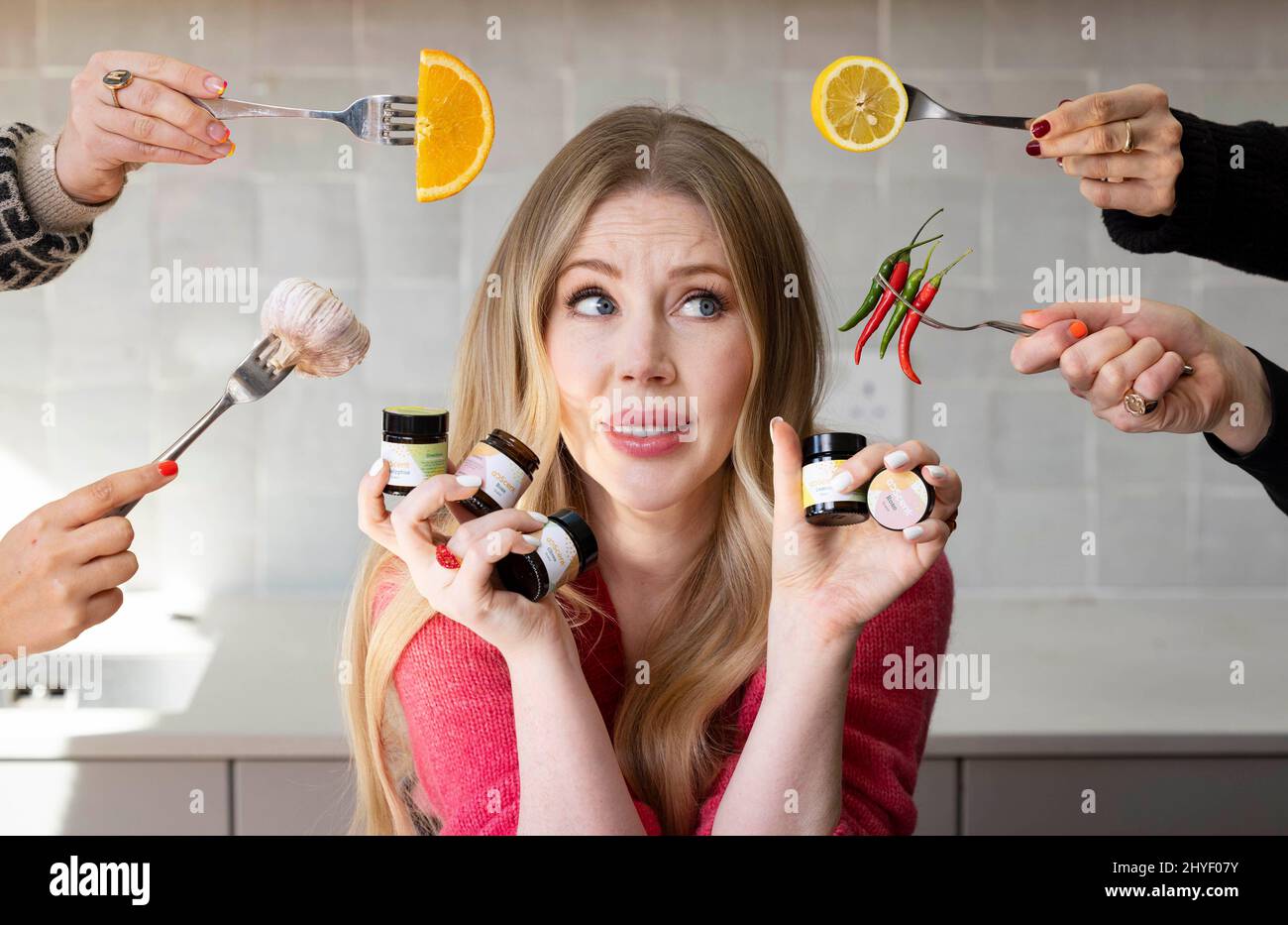 EDITORIAL USE ONLY Katherine Ryan tests recipes from the new limited-edition 'Flavour Saviour' kit, created by meal kit retailer Gousto and smell loss experts AbScent, London. Issue date: Monday March 14, 2022. Stock Photo