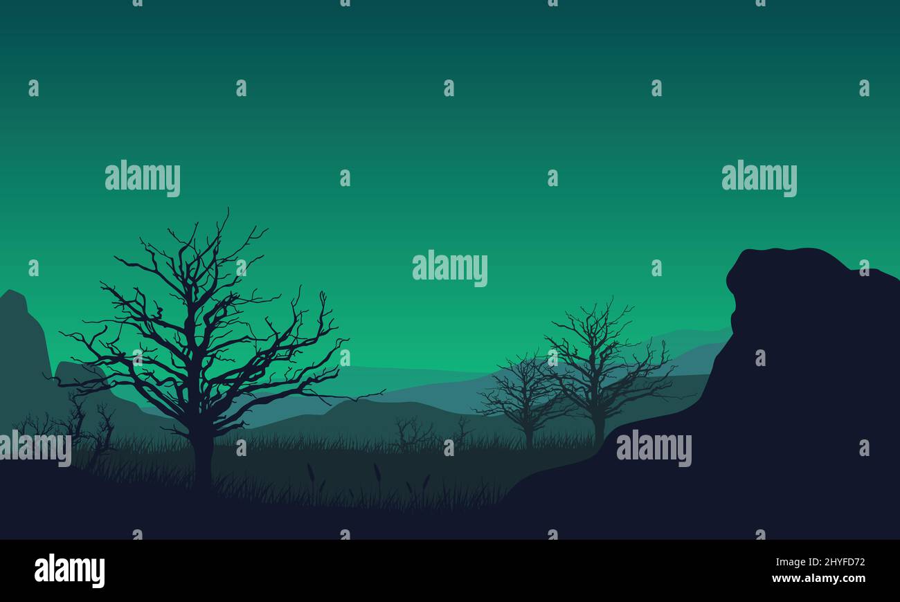 Aesthetic mountain view with the silhouette of dry pine trees and ...