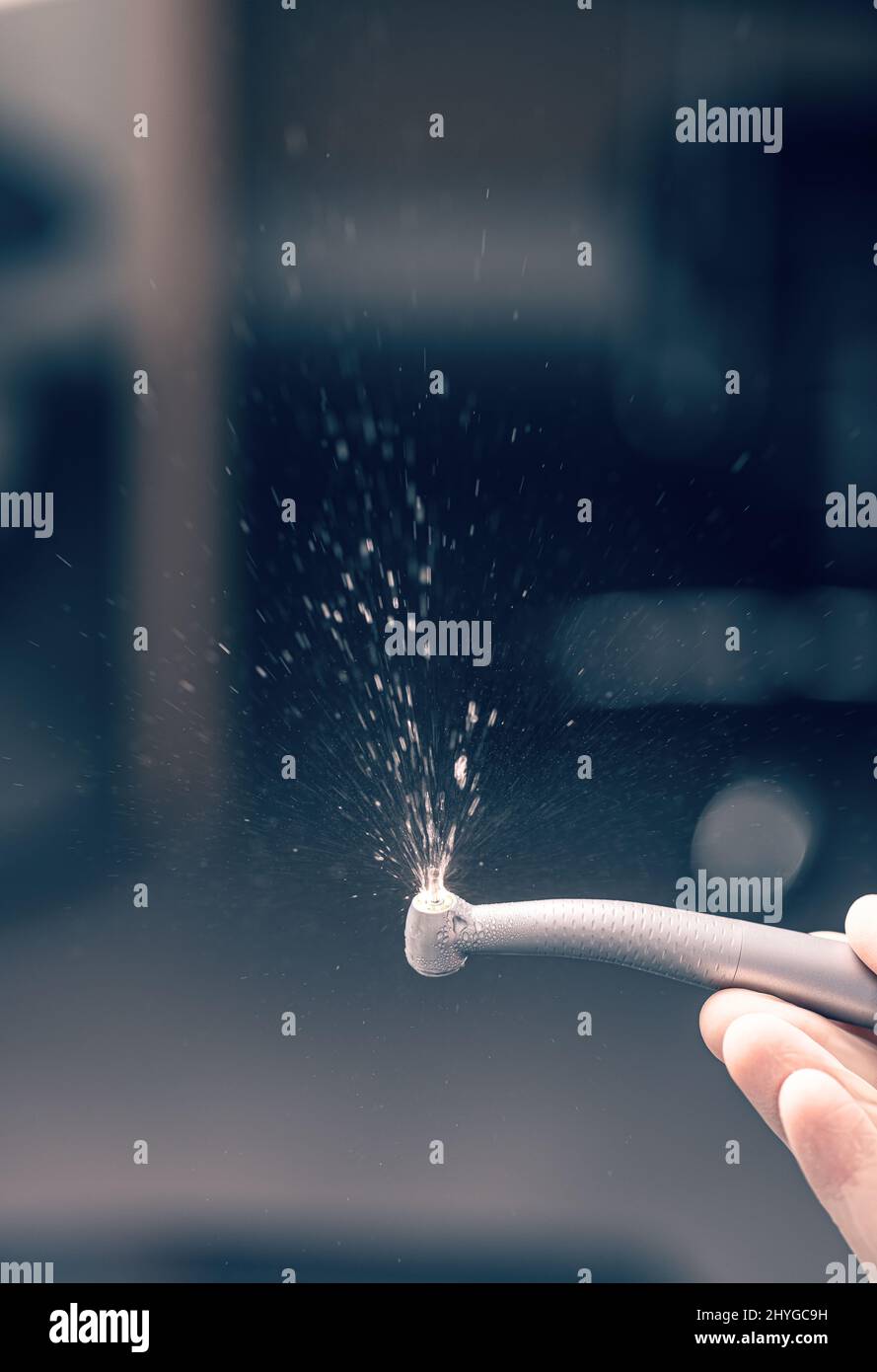 Dentist hand with dental drill machine with water Stock Photo Alamy