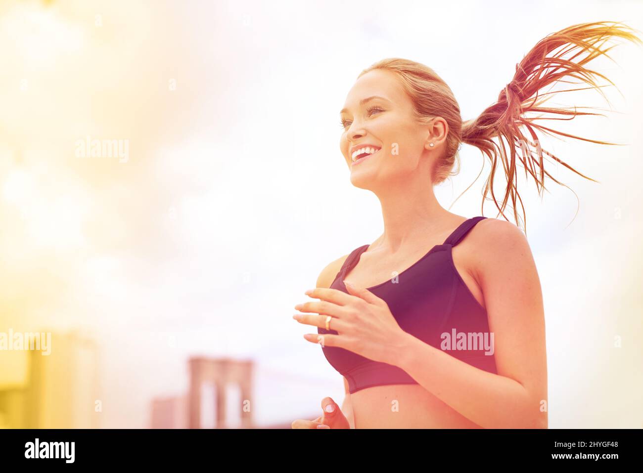 https://c8.alamy.com/comp/2HYGF48/jog-for-joy-shot-of-an-attractive-blonde-woman-jogging-in-the-city-2HYGF48.jpg