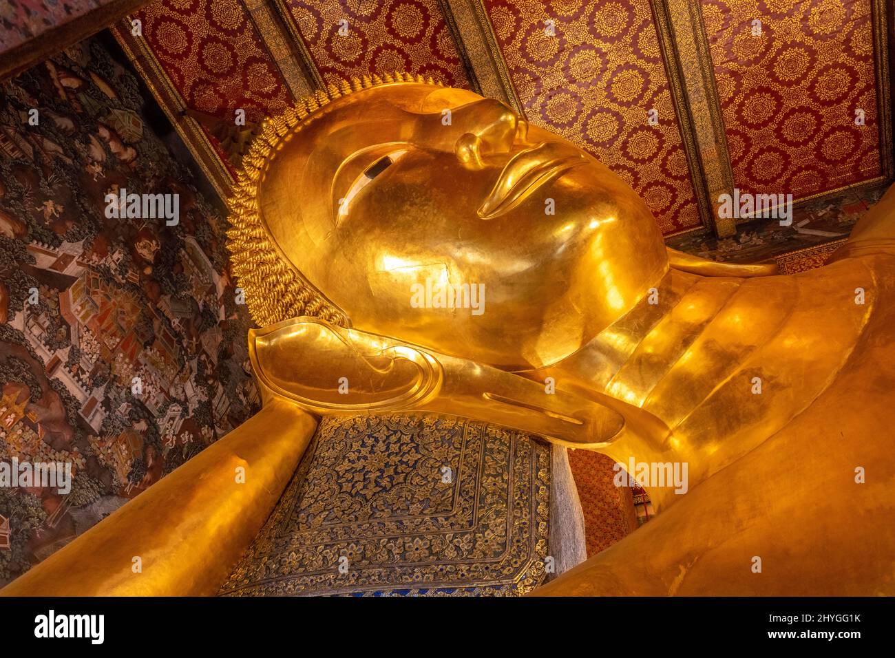 Giant golden reclining Buddha statue at Wat Pho Temple in Bangkok Stock
