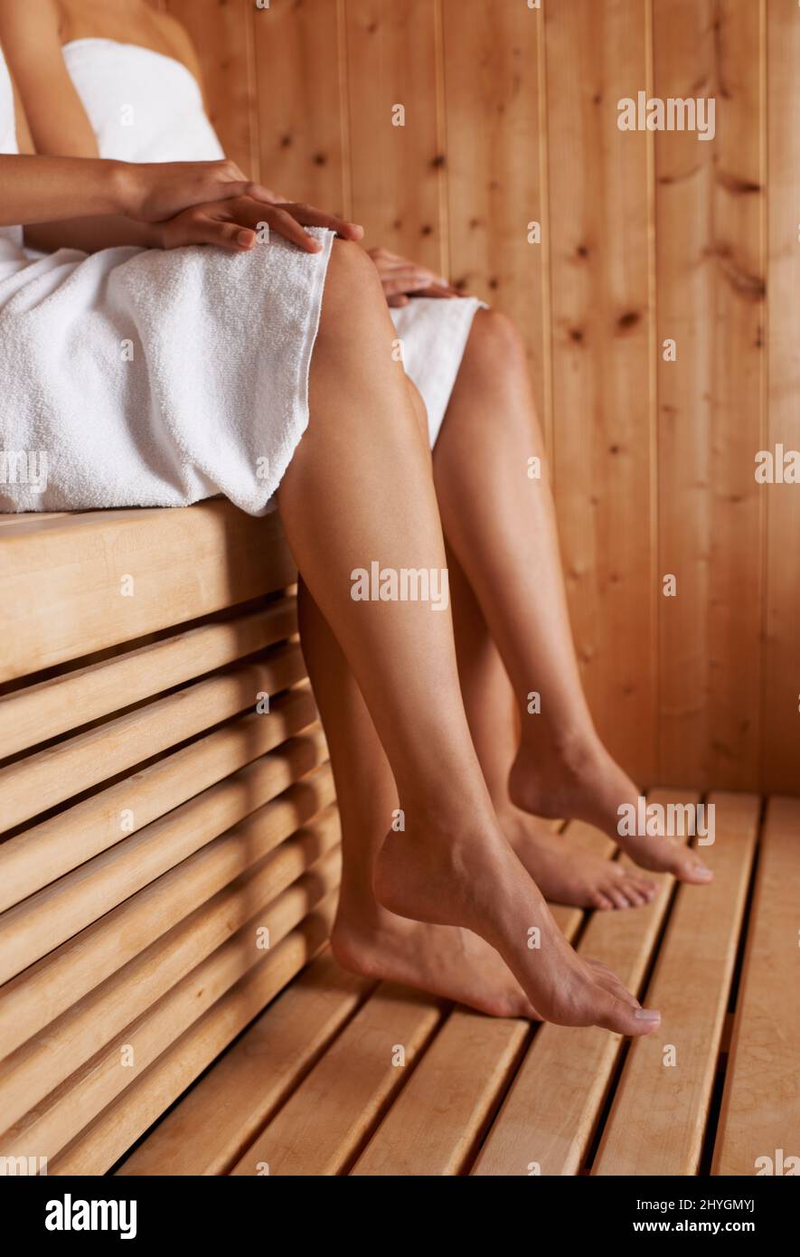Enjoying the sauna. Cropped image of two friends sitting in the sauna together Stock Photo Alamy