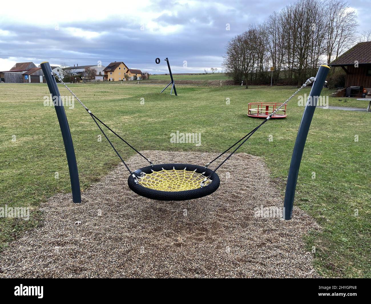 Blue nest swing in the yard for outdoor activity and fun Stock Photo ...