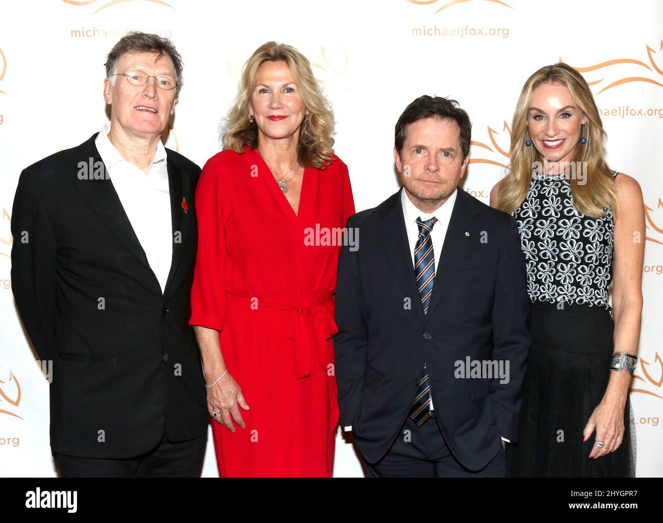Steve Winwood, wife Eugenia Winwood, Michael J. Fox & Tracy Pollan at A Funny Thing Happened on the Way to Cure Parkinson's held at the Hilton New York on November 10, 2018 in New York City, NY Stock Photo