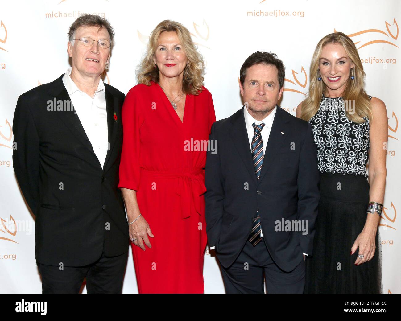 Steve Winwood, wife Eugenia Winwood, Michael J. Fox & Tracy Pollan at A Funny Thing Happened on the Way to Cure Parkinson's held at the Hilton New York on November 10, 2018 in New York City, NY Stock Photo