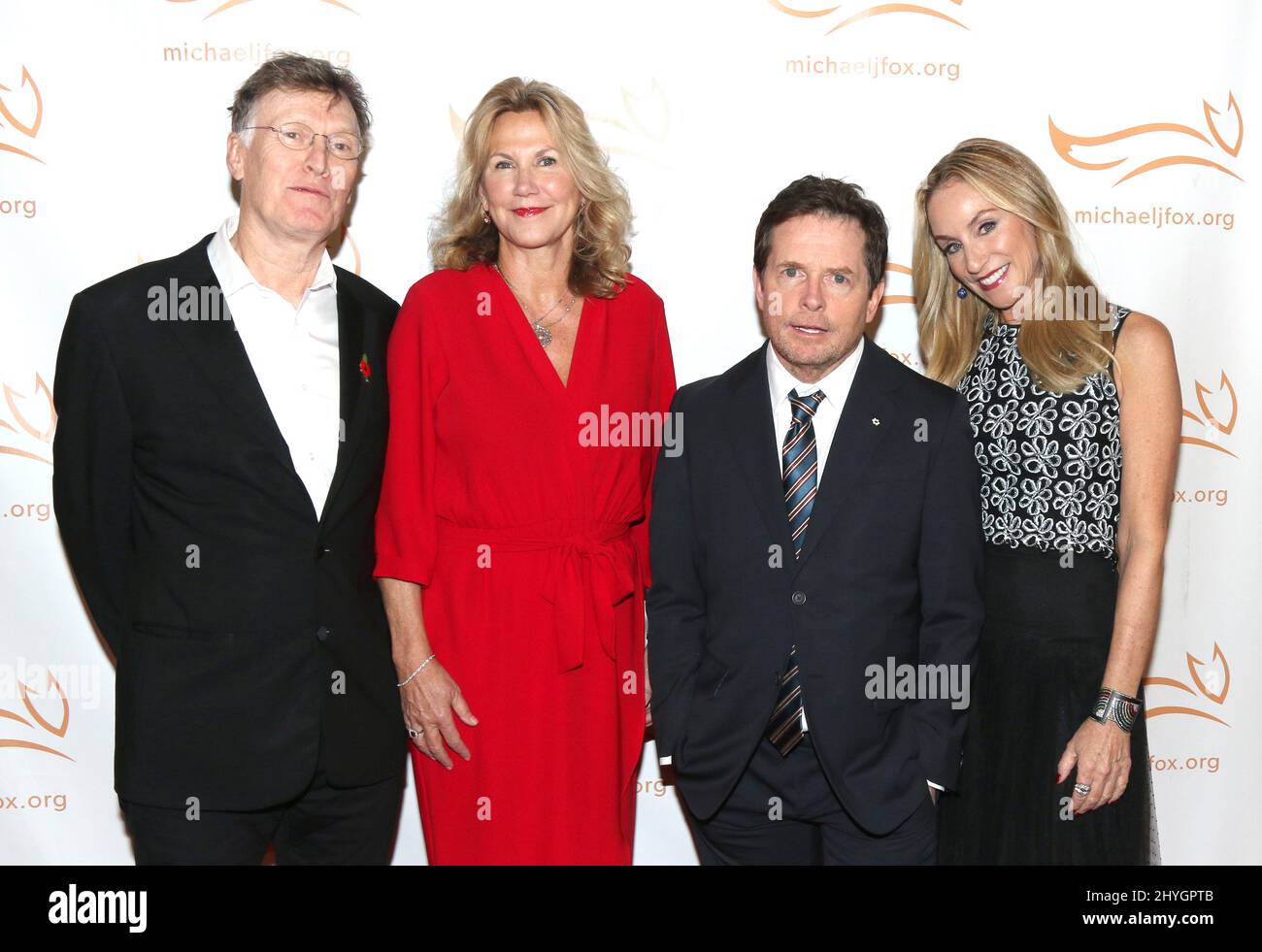 Steve Winwood, wife Eugenia Winwood, Michael J. Fox & Tracy Pollan at A Funny Thing Happened on the Way to Cure Parkinson's held at the Hilton New York on November 10, 2018 in New York City, NY Stock Photo