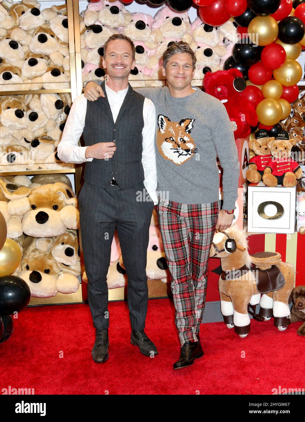 Neil Patrick Harris & David Burtka attending the FAO Schwarz Opening Preview in New York Stock Photo