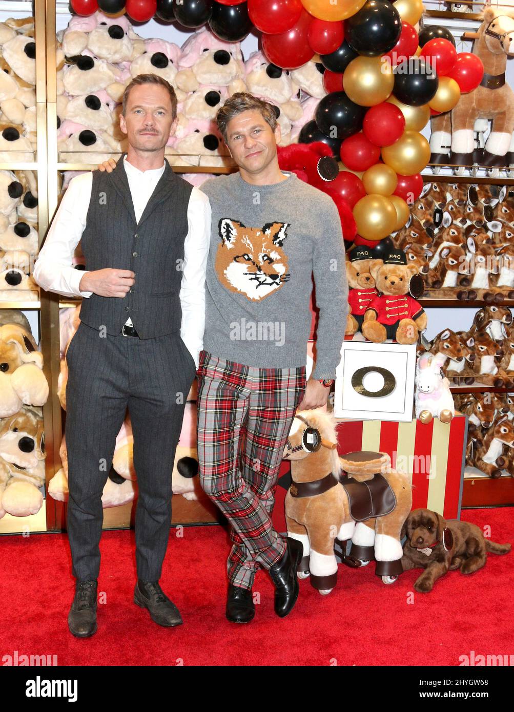 Neil Patrick Harris & David Burtka attending the FAO Schwarz Opening Preview in New York Stock Photo