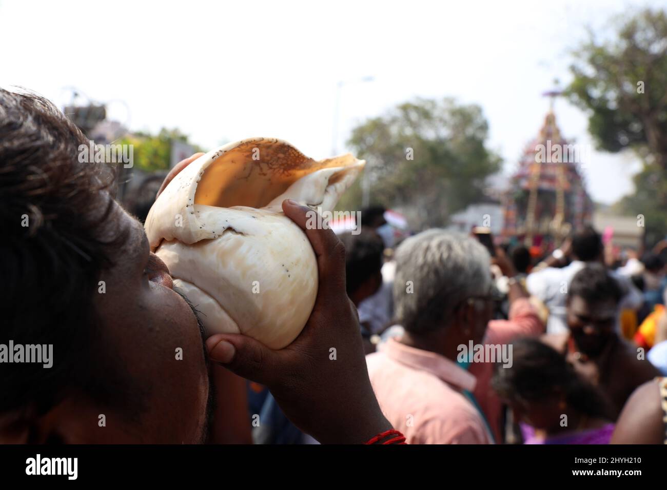 Chennai, Tamil Nadu, India. 15th Mar, 2022. Hindu devotees blow horns and shells during an during an annual temple car festival procession in Chennai. (Credit Image: © Sri Loganathan/ZUMA Press Wire) Stock Photo
