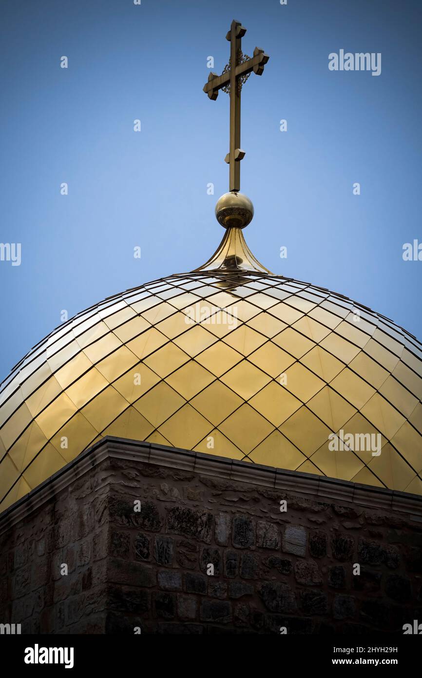 Golden-topped dome and cross in the old city of Jerusalem in Israel Stock Photo