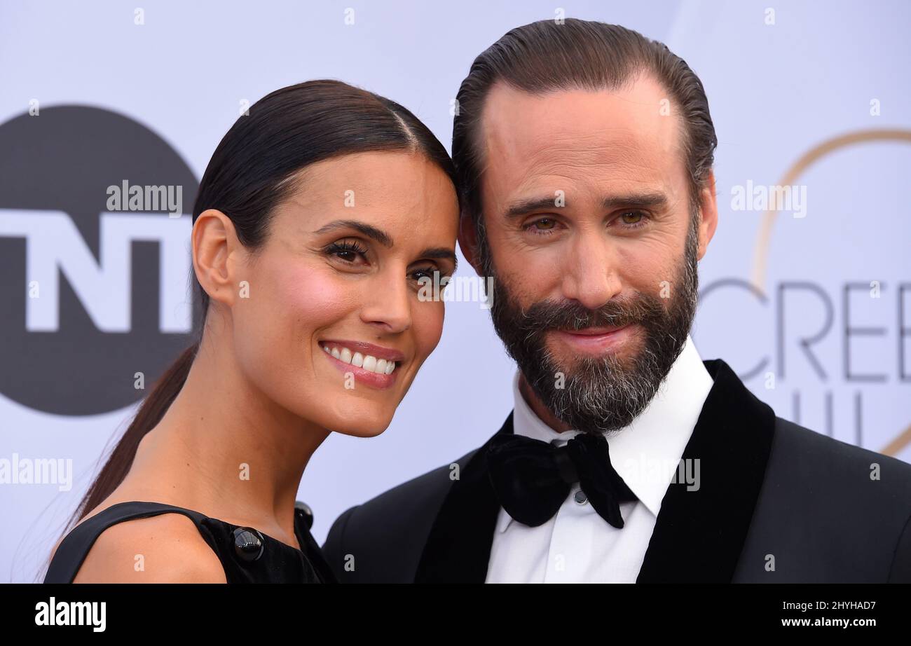 Maria Dolores Dieguez and Joseph Fiennes attending the 25th Annual Screen Actors Guild Awards held at the Shrine Auditorium Stock Photo
