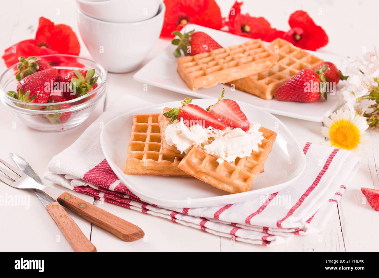 Waffles with strawberries and whipped cream Stock Photo - Alamy