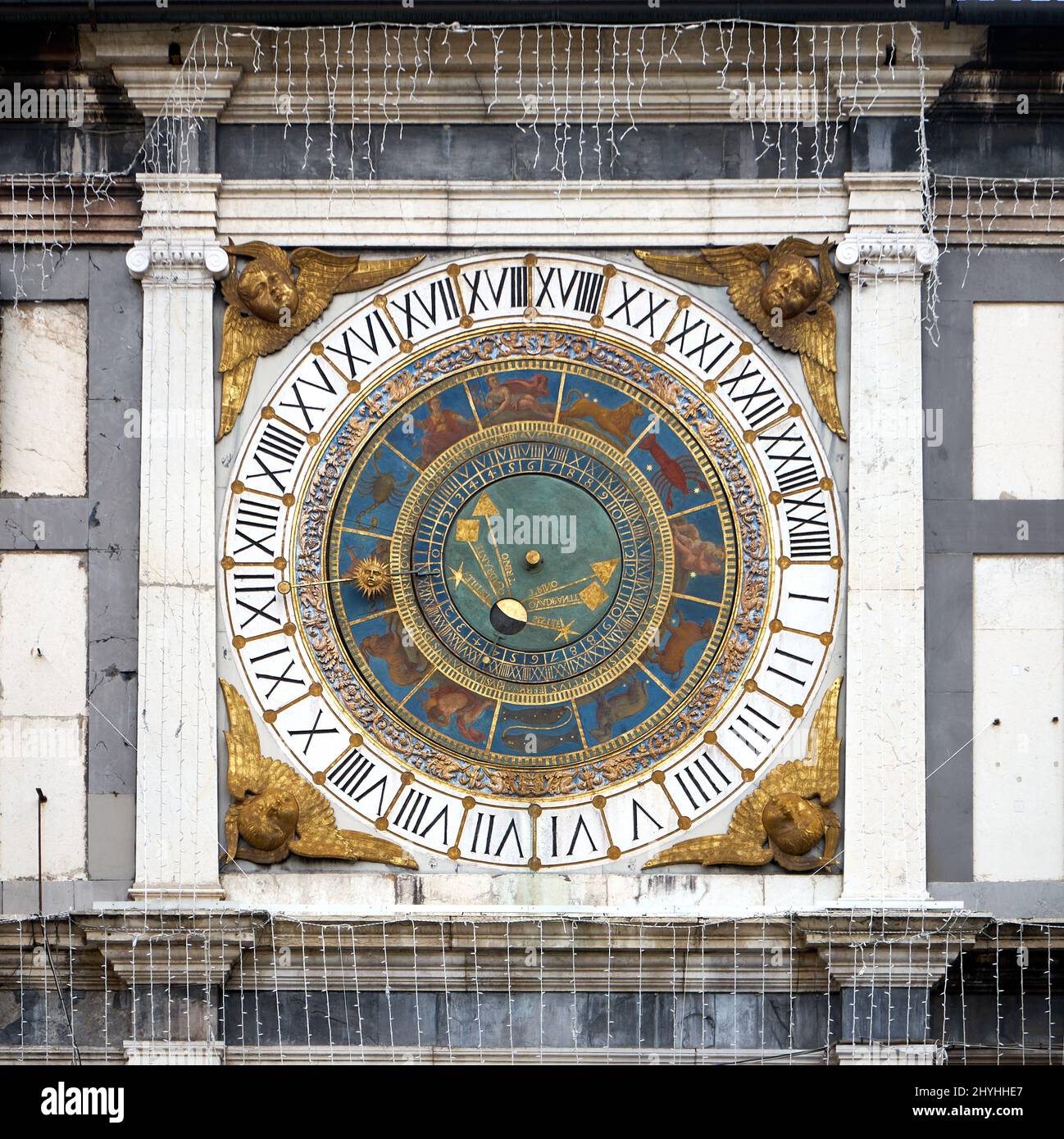 Brescia clock tower with angel sculptures on a building in Italy Stock