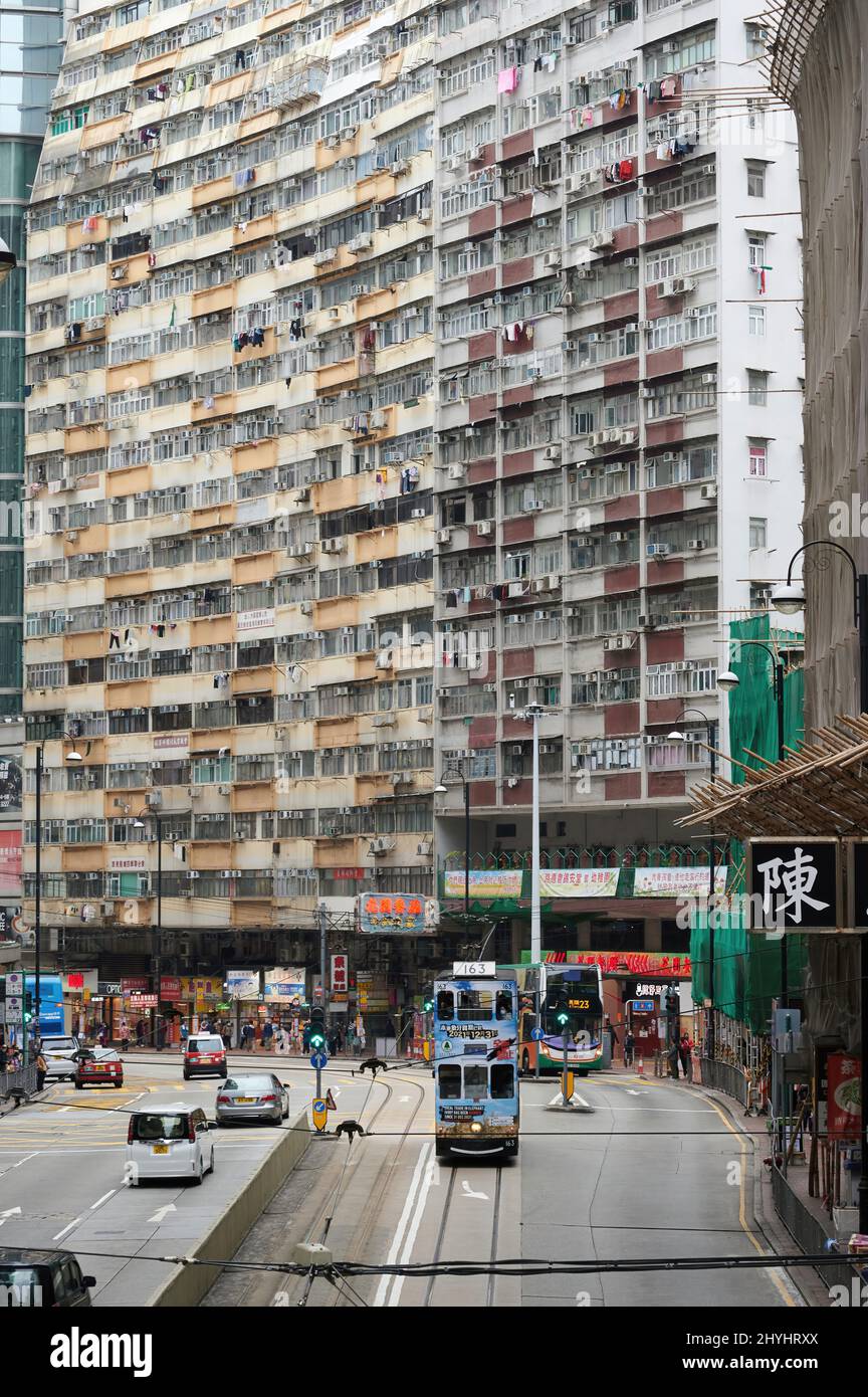 Vertical shot of tall buildings and a busy street in Hong Kong Stock