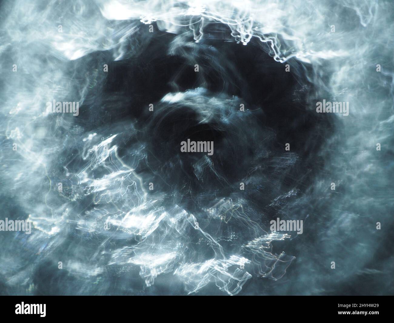 Abstract mist background. Bright and atmospheric smoke on dark