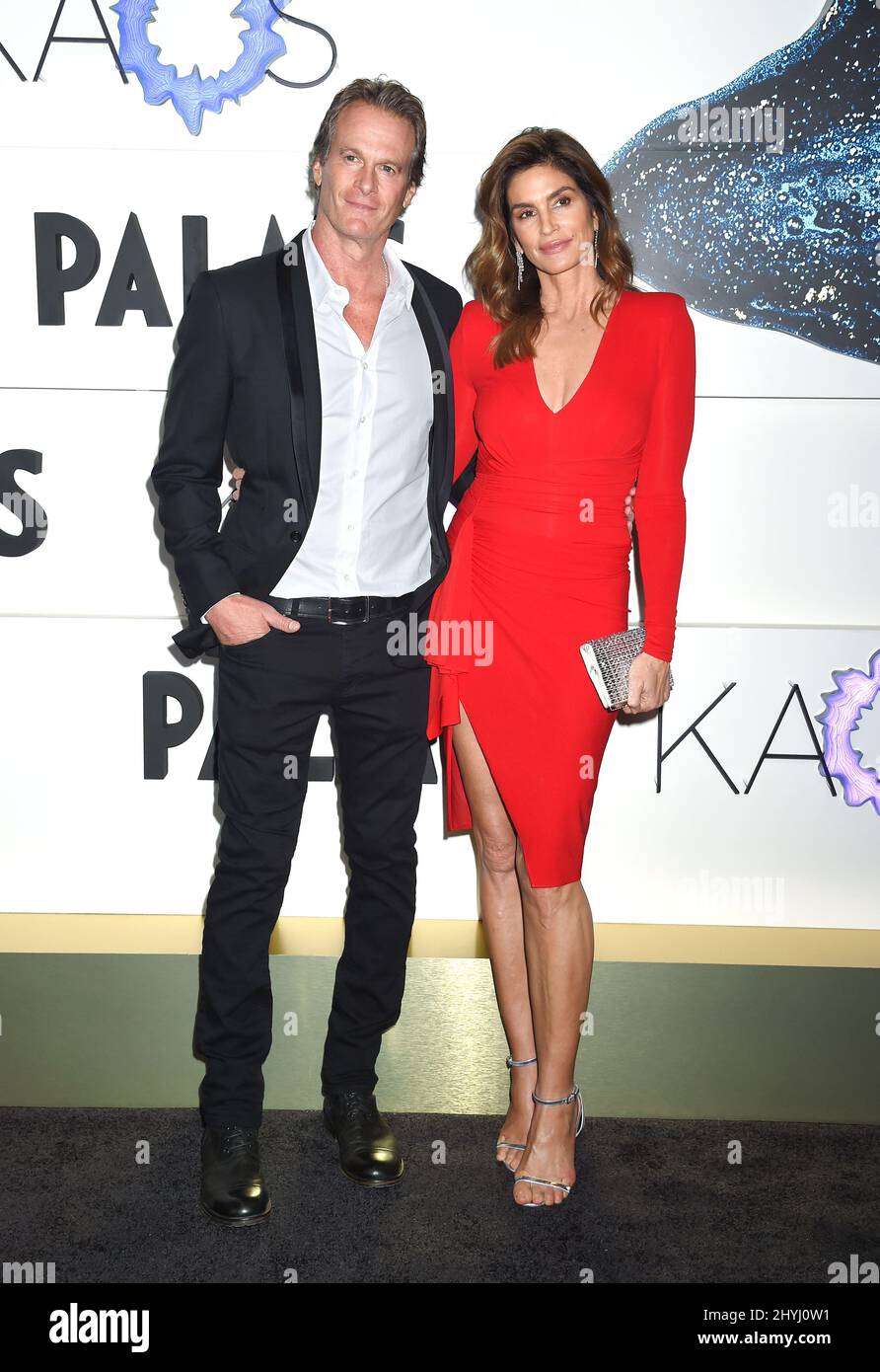 Rande Gerber and Cindy Crawford at the grand opening of KAOS in the