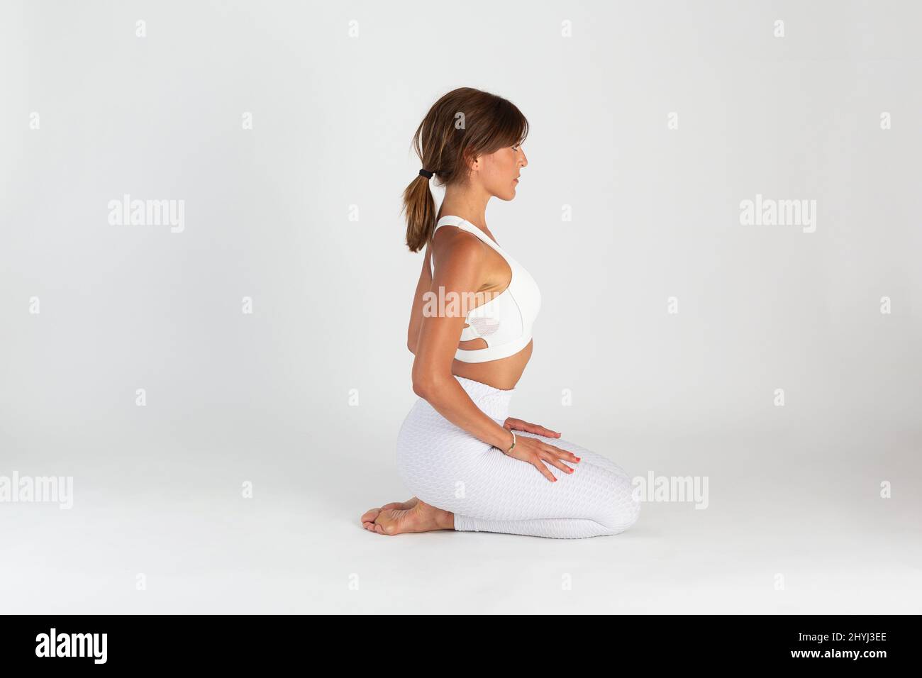 Female at yoga session in studio isolated on a white background Stock ...