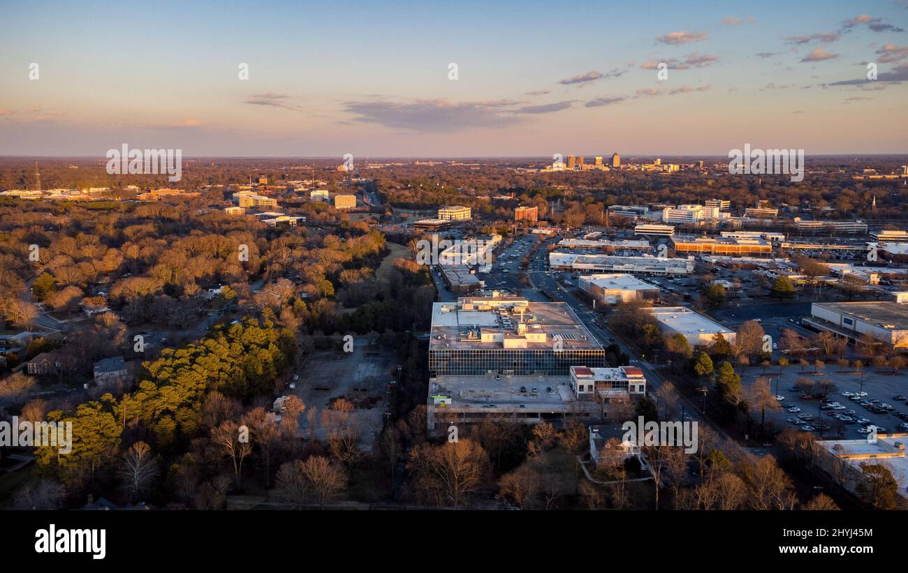 Aerial beautiful view of trees, buildings and shopping center on the