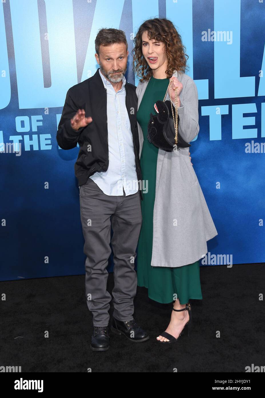 Breckin Meyer and Linsey Godfrey arriving to the 'Godzilla King of the Monsters' Stock Photo