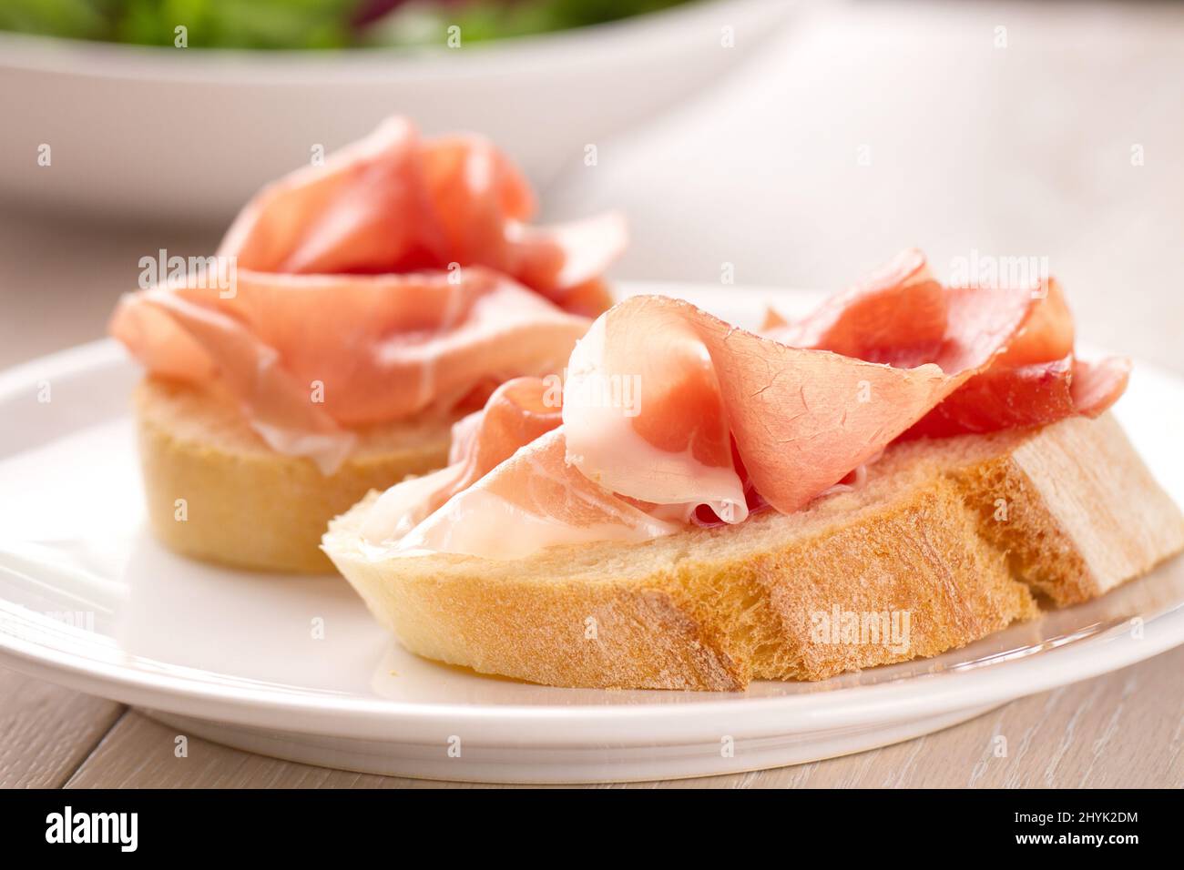 Italian appetizer bruschetta with Parma ham on a plate Stock Photo