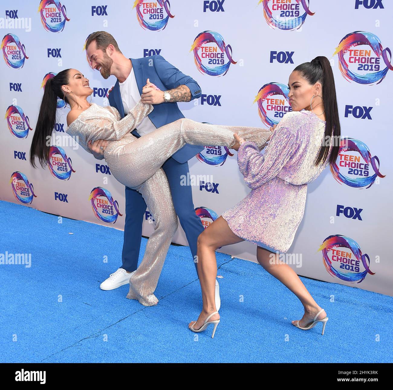 Nikki Bella, Artem Chigvintsev and Brie Bella attending the Teen Choice